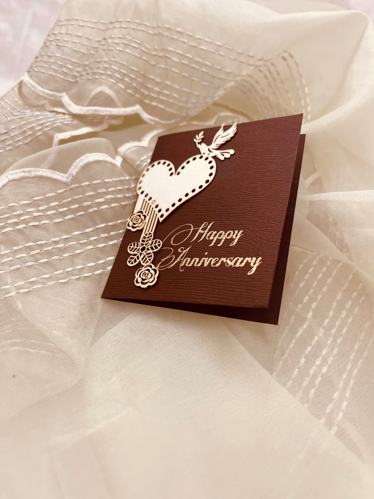 brown coloured anniversary gift tags with heart, birds and floral designs on it