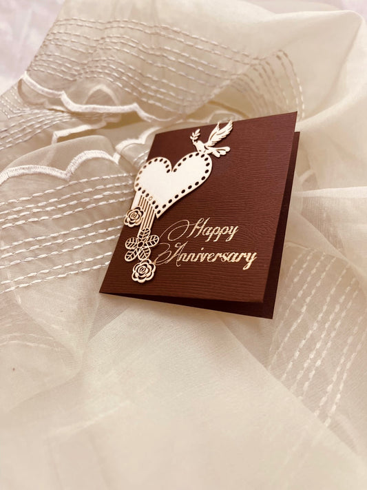 brown coloured anniversary gift tags with heart, birds and floral designs on it