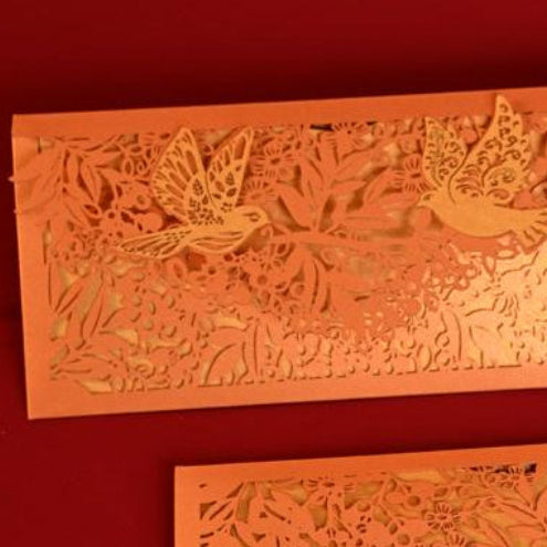 Sagun Envelope Orange Rust colour, with golden inner, and pair of birds on its flap