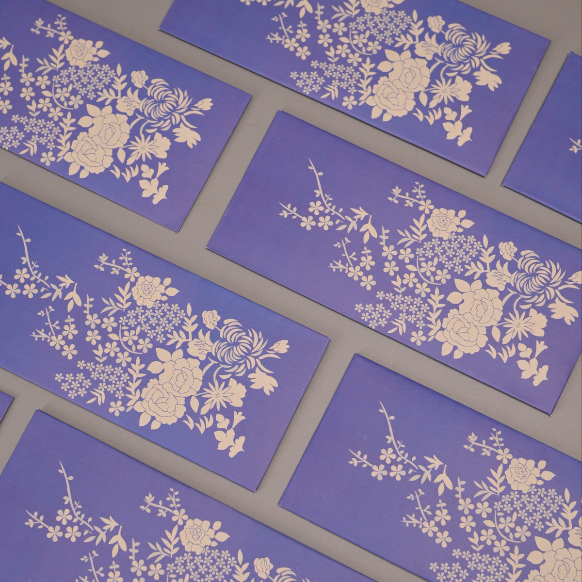 purple envelopes with white floral patterns