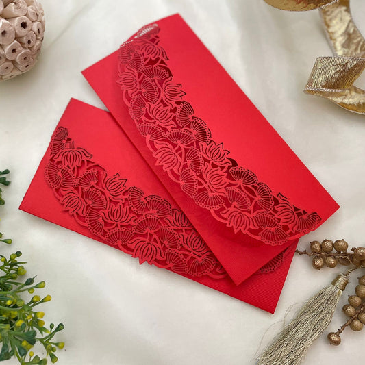 Two red envelopes with intricate laser-cut designs of pitchwai motifs lotus