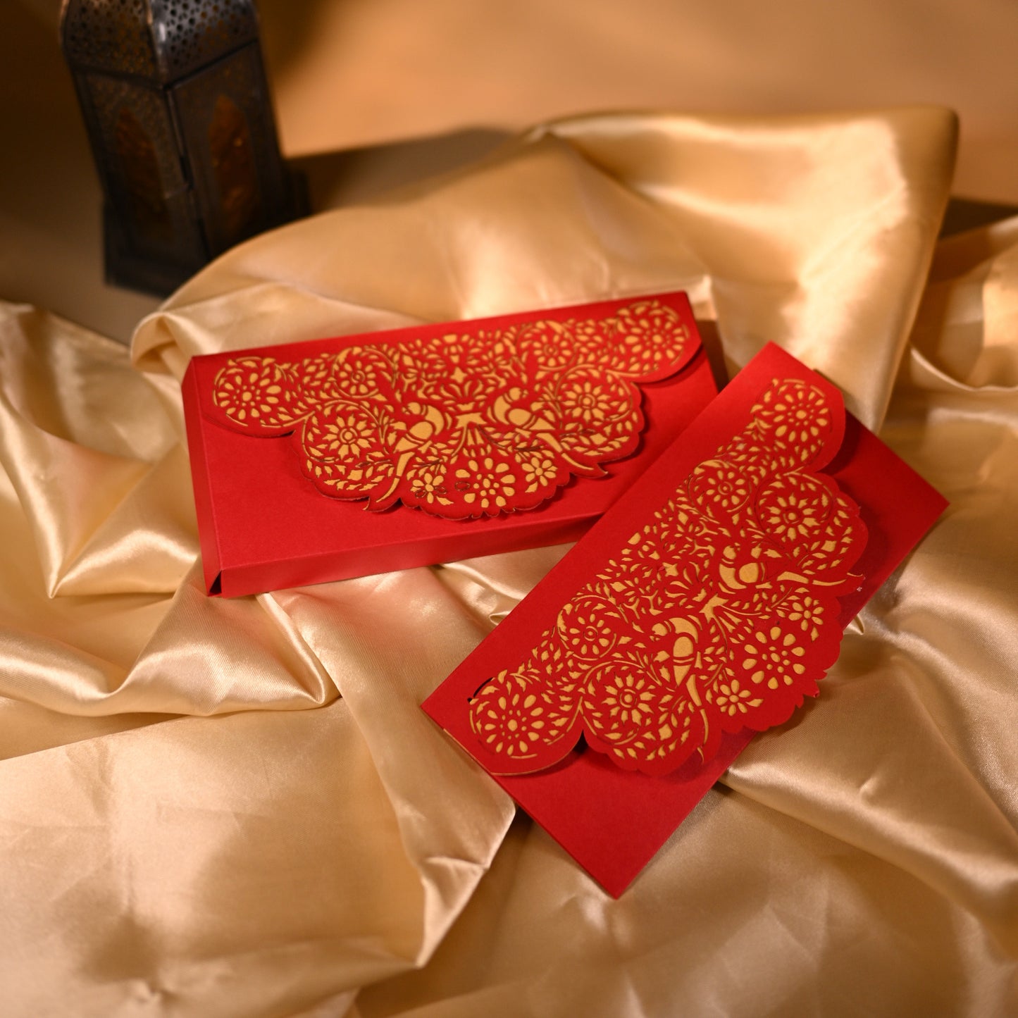 Red envelope with gold floral and bird patterns