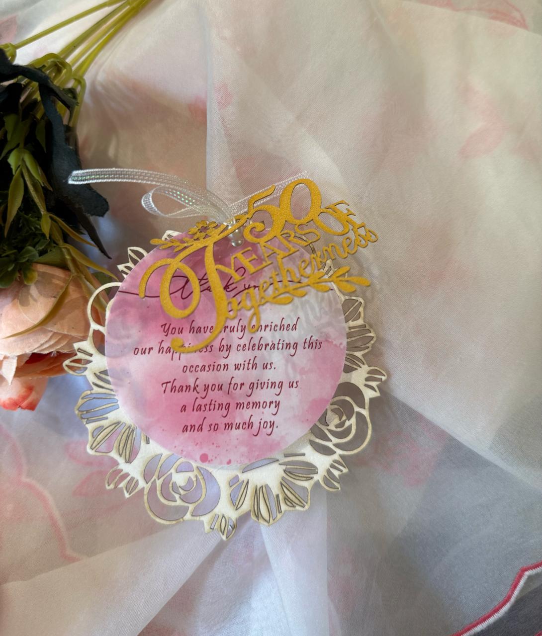 50th birthday tag with a decorative border, a pink middle layer, and text that reads '50'