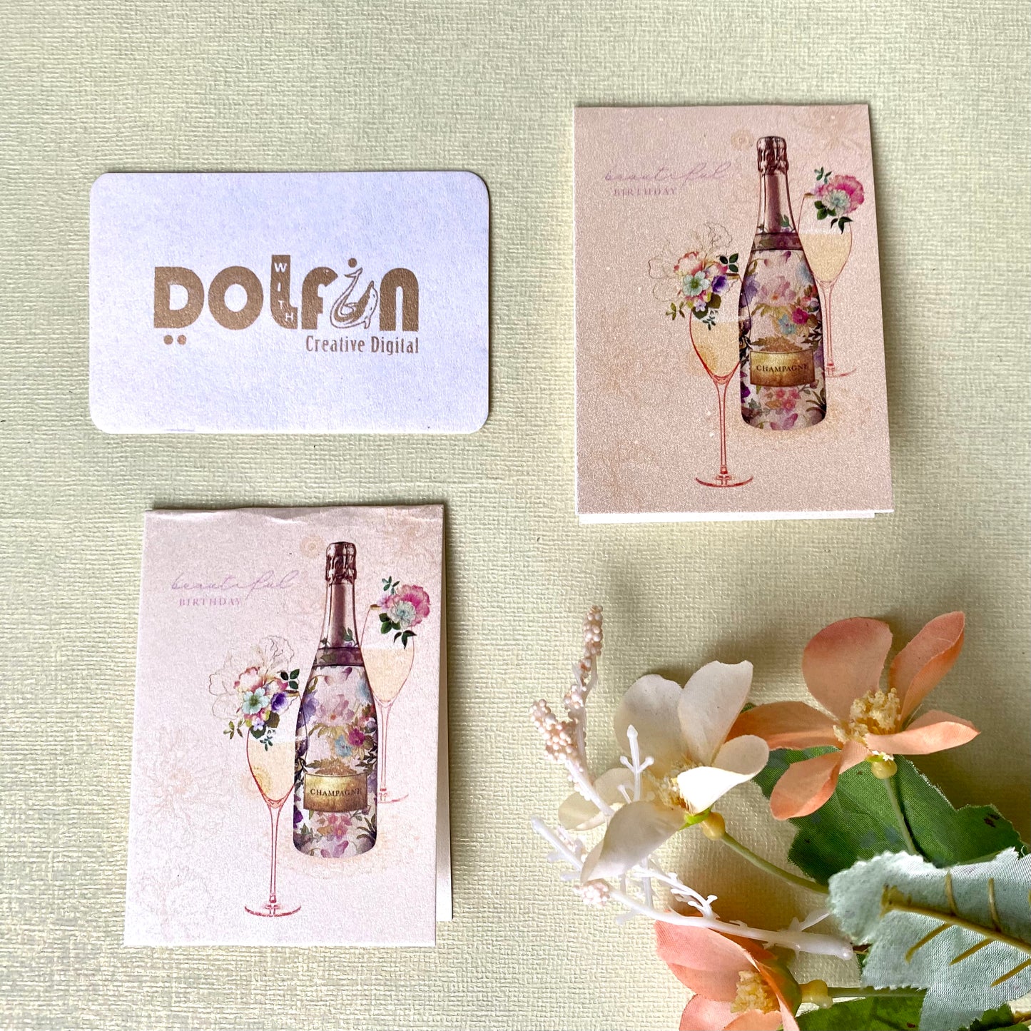 A set of metallic pink printed gift tags with a champagne theme