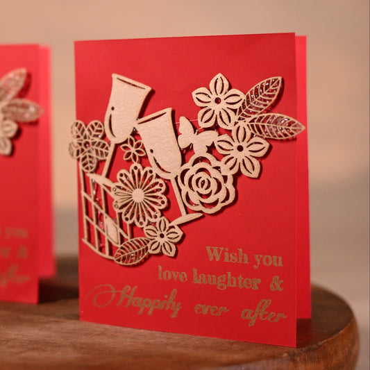 red gift tags with floral laser-cut patchwork and drinking glasses