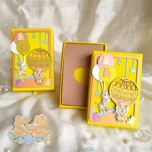 Coin box / Ginni Box with parachute theme on green cardboard box, decorated with hot air ballon, lion, teddy, zebra
