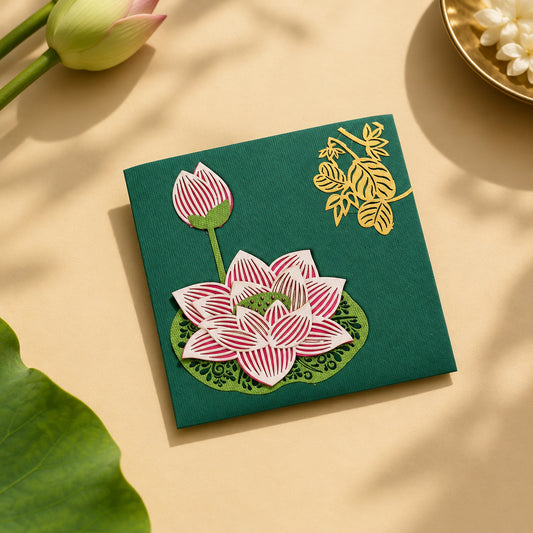 small green lotus envelope with laser-cut lotus work on one side and golden leaf motifs on the other