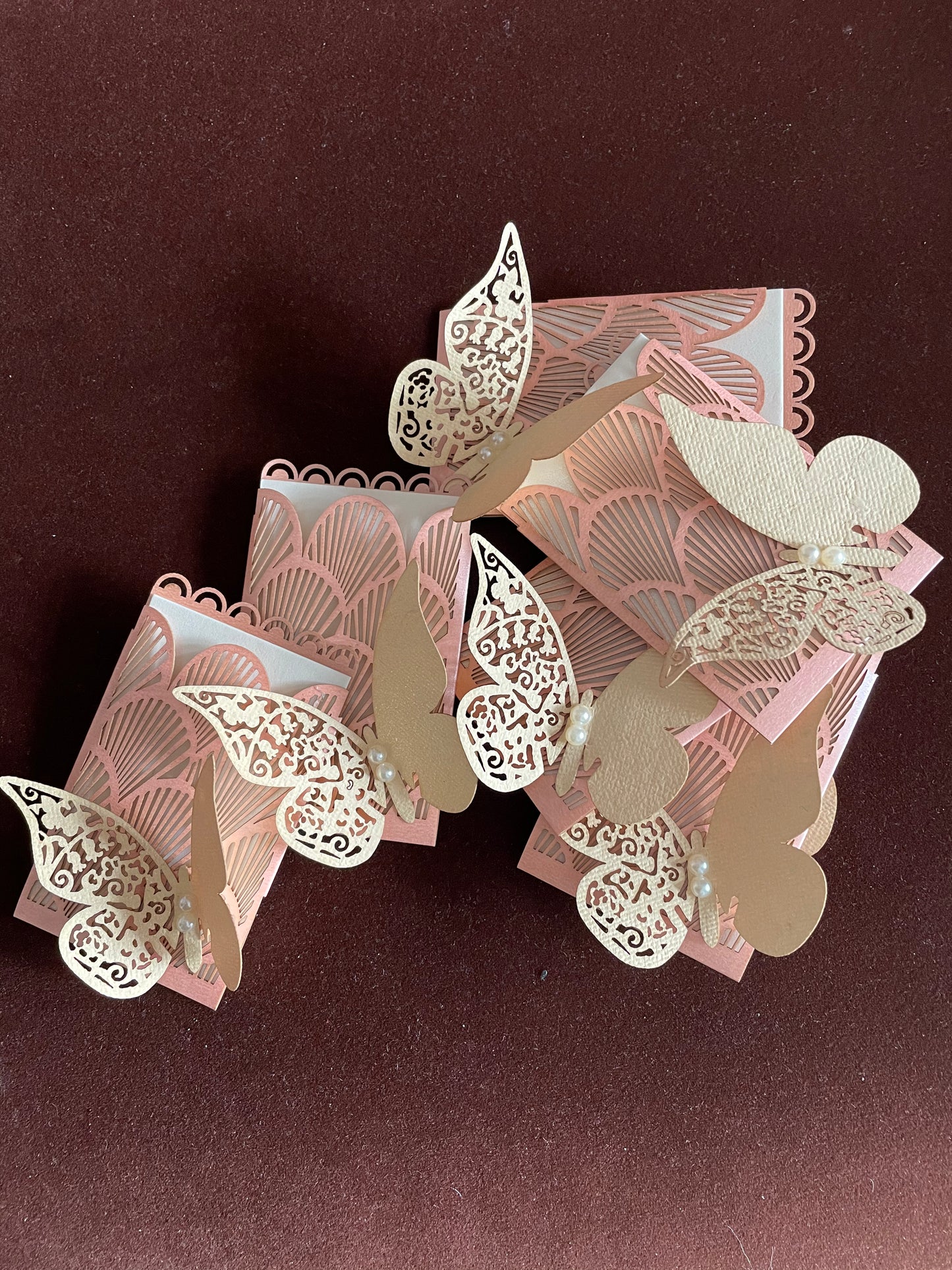 pink coin pockets with laser-cut detailing and beautful butterflies with pearls