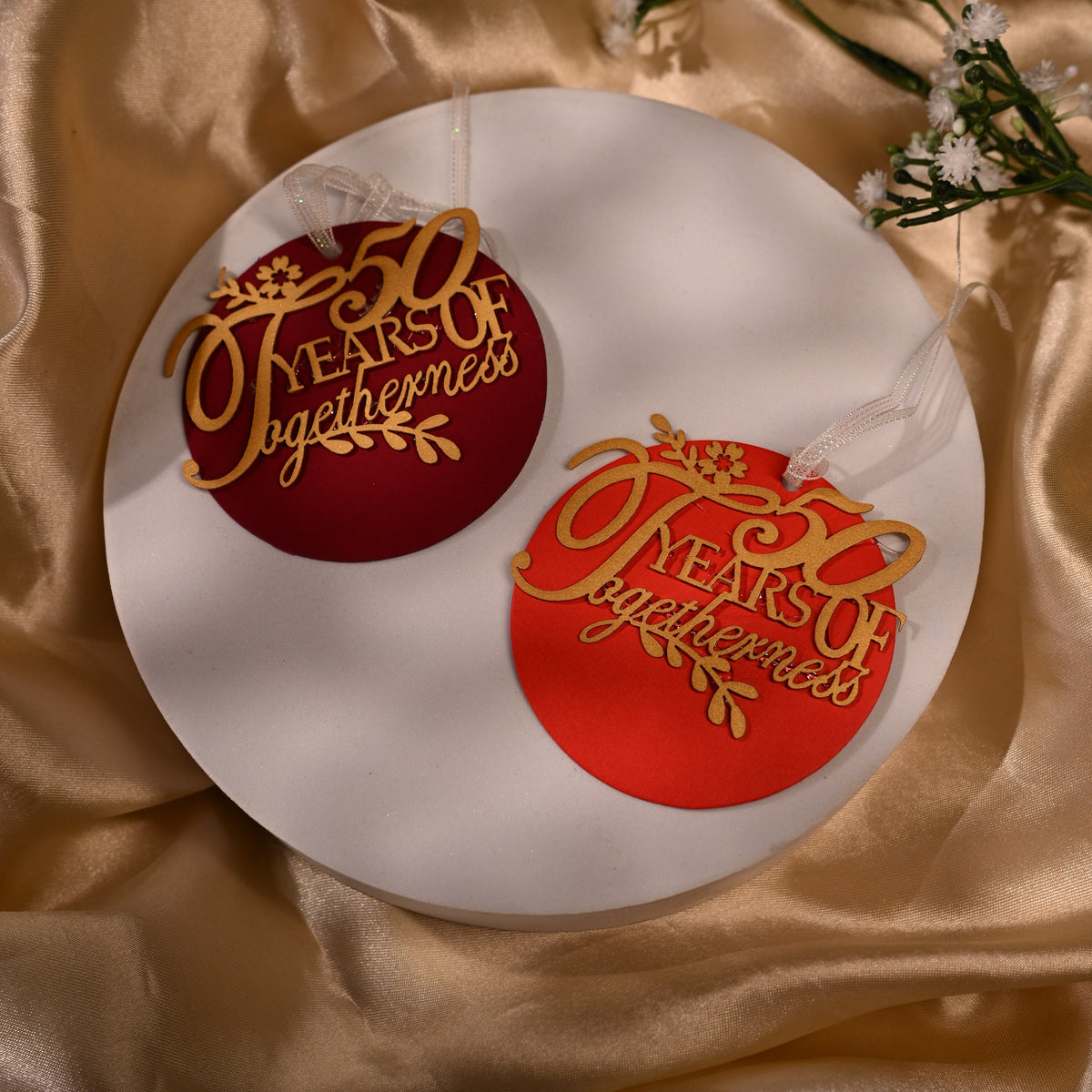 Circular anniversary gift tags with delicatge laser cut writing