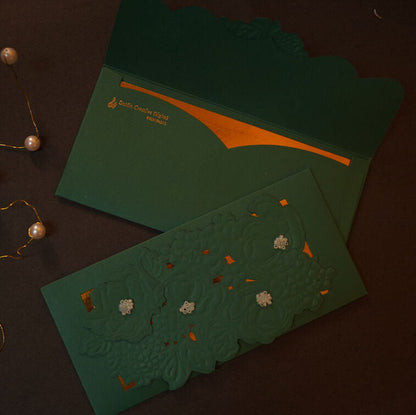 Emboosed floral pattern on an green & Silver envelope.