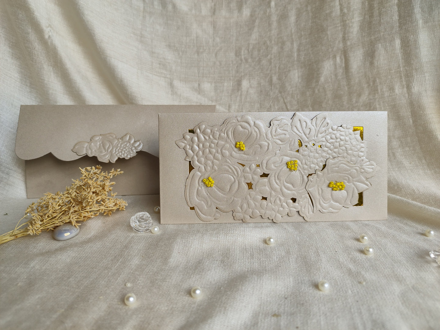Silver ambrosia sagun envelope with flower embossing and cutting