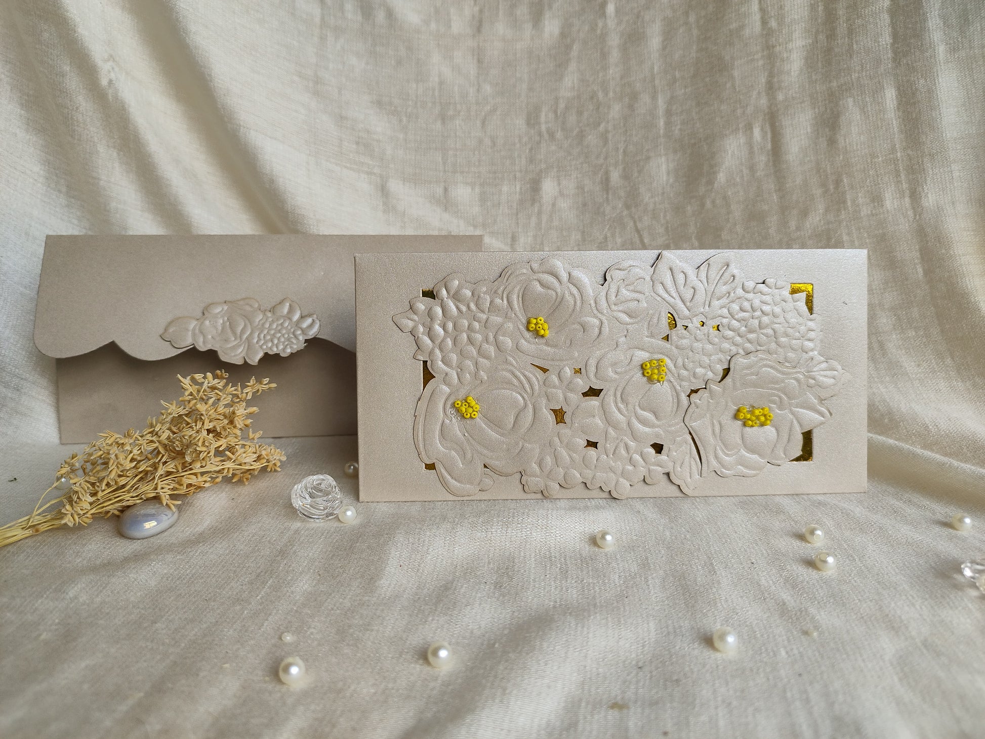 Silver ambrosia sagun envelope with flower embossing and cutting