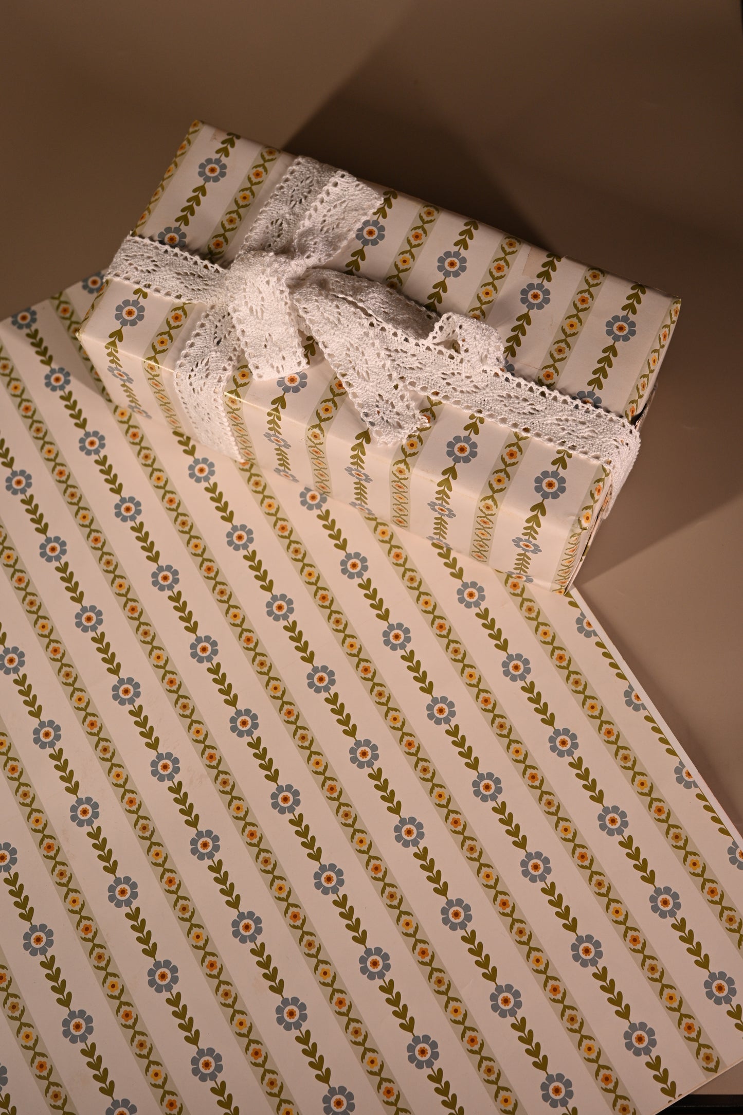 This reversible wrapping paper having two distinct vibes—the bold, energetic orange and pink blooms on one side and the clean, white minimal design on the other—makes it such a versatile staple for a gift-wrap stash.