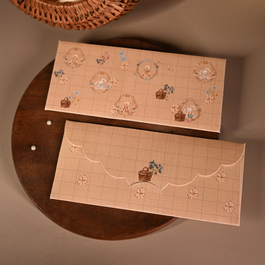 Light brown envelope with baby bears and baskets of flowers for kids