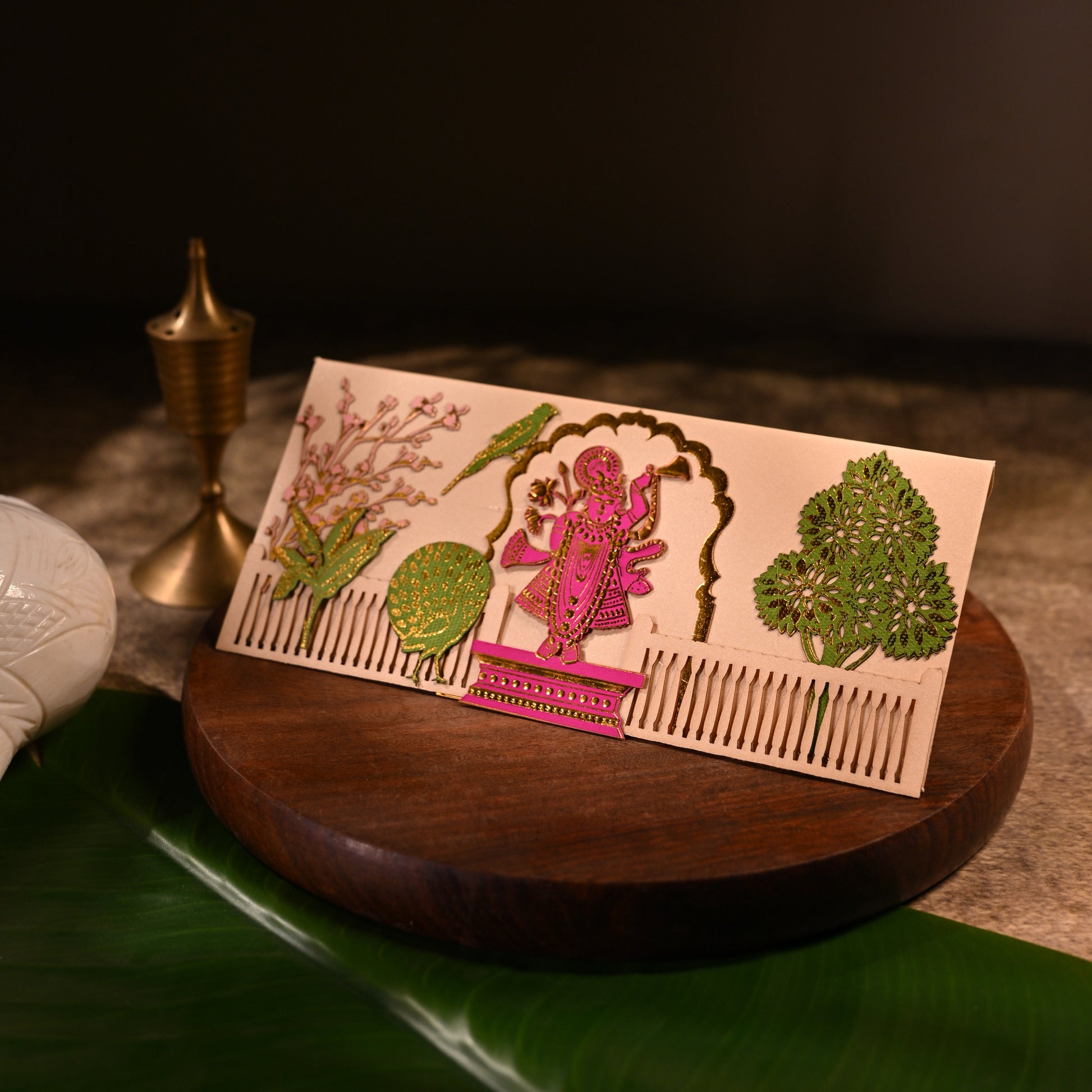 envelope featuring intricate aser cut design and shree nathji