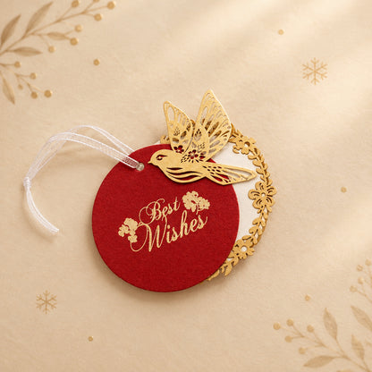 Layered red gift tags with gold 'Best Wishes' text and gold bird cut-outs, in laser cut detailing