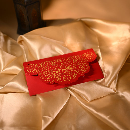 Red cash box with gold floral and bird patterns 