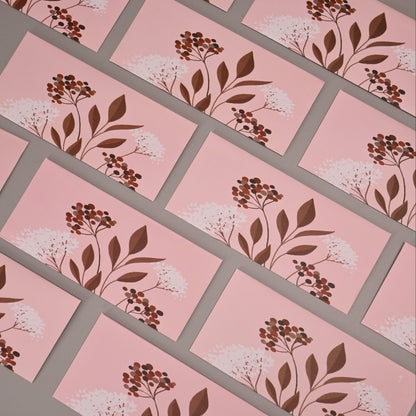 Envelopes printed with a botanical floral pattern in brown and white.