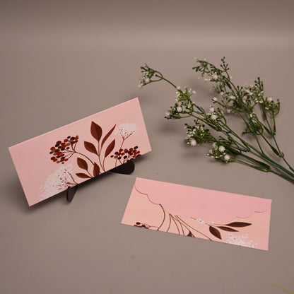 Envelope botanical illustrations, displayed on a neutral taupe background with baby's breath flowers.