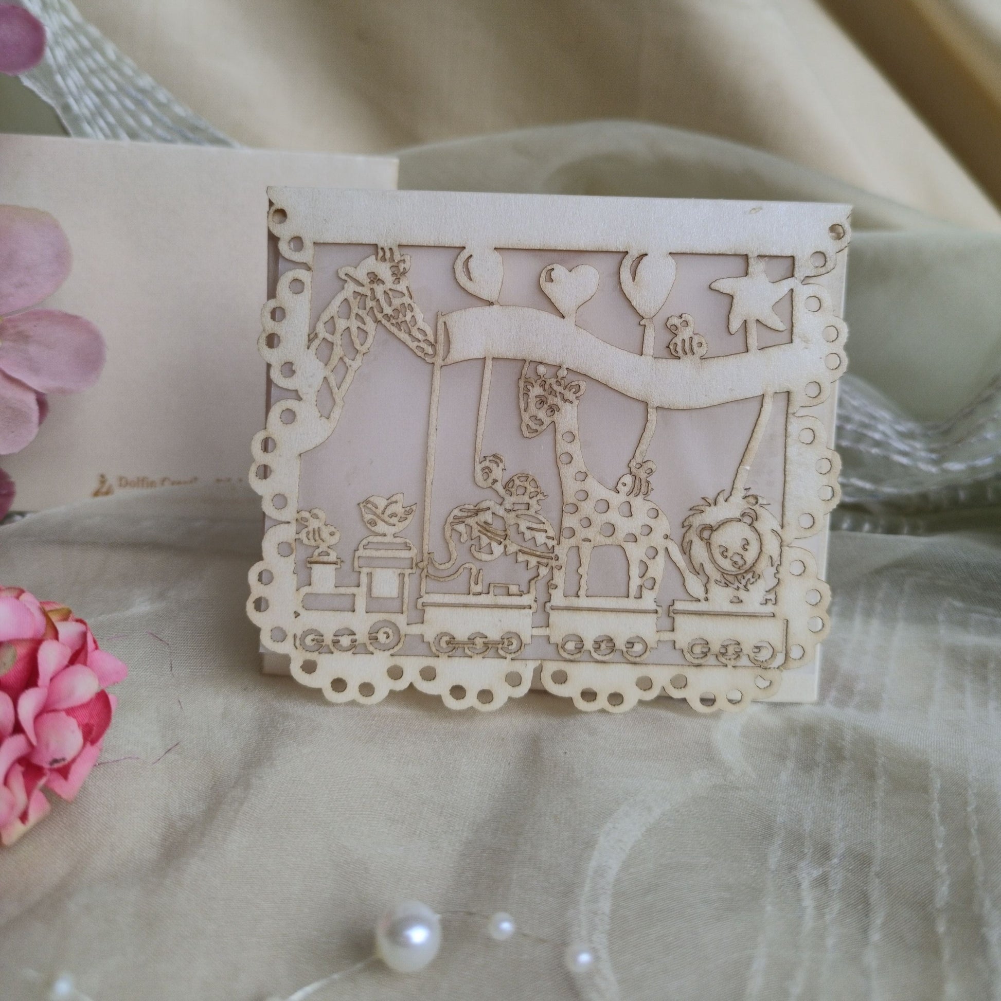A collection of colourful laser cut envelopes with a design featuring animals