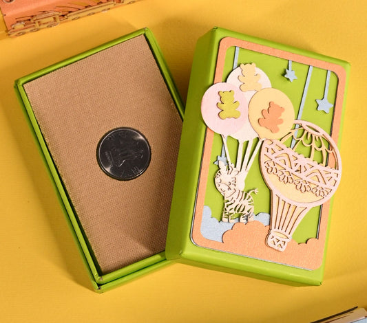 Coin box / Ginni Box with parachute theme on green cardboard box, decorated with hotair ballon, teddy, zebra