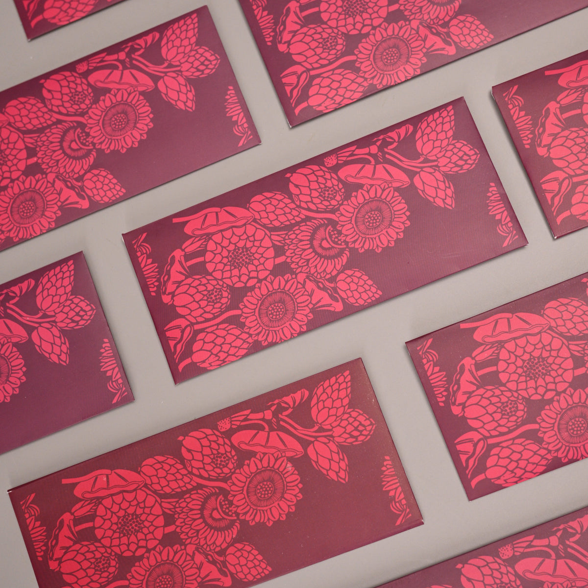  Deep maroon with vibrant floral motifs inspired by dahlias and sunflowers