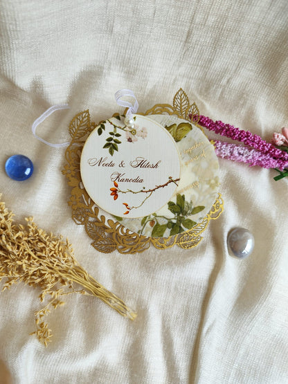 Customised round white and golden gift tags with laser cut design and 3 layers