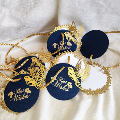 Layered blue gift tags with gold 'Best Wishes' text and gold bird cut-outs, in laser cut detailing