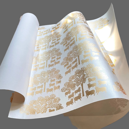 wrapping paper with a gold pichwai print design, featuring tree patterns
