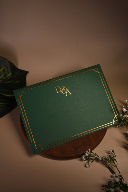Green invitation card with gold embossing