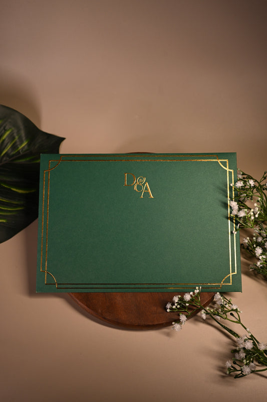 Green invitation card with gold embossing