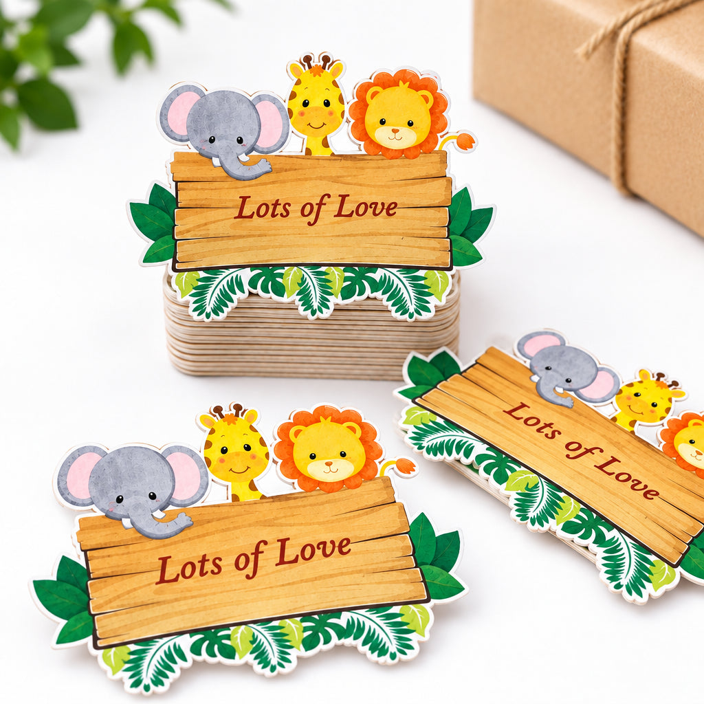 Three custom jungle-themed place cards with cartoon animals and a white envelope