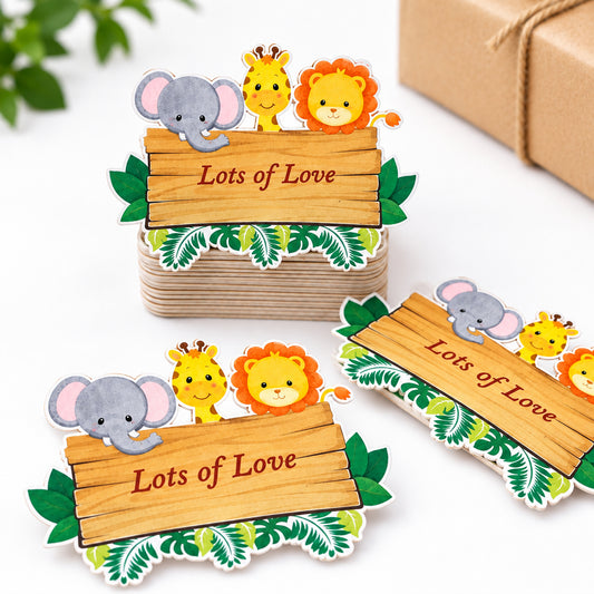 Three custom jungle-themed place cards with cartoon animals and a white envelope
