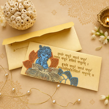 Yellow envelope with a laser patchwork design featuring an image of Krishna and mantras