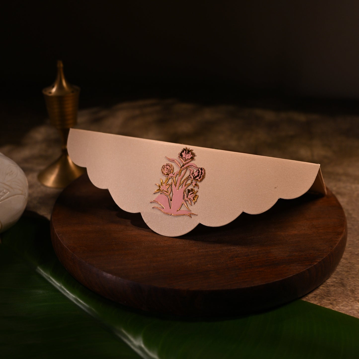 envelope featuring intricate aser cut design and shree nathji
