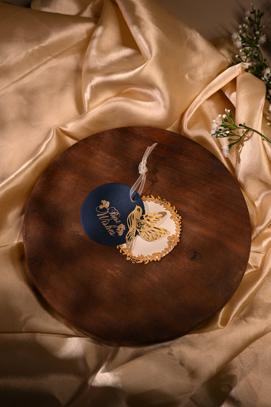 Layered blue gift tags with gold 'Best Wishes' text and gold bird cut-outs, in laser cut detailing