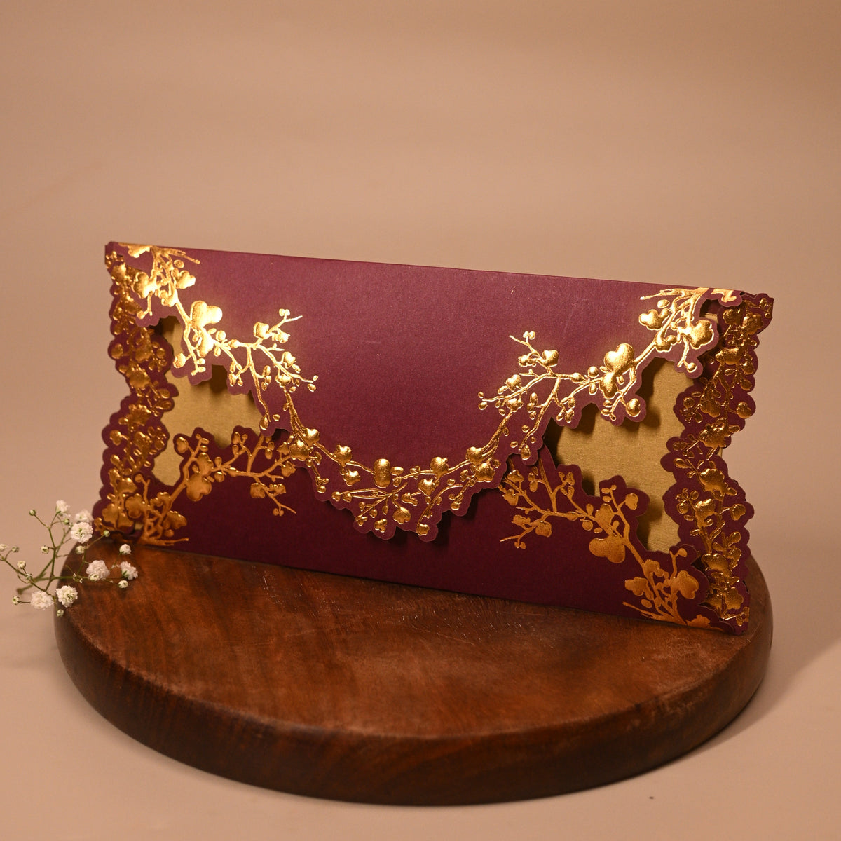 A burgundy Ocean Vibe Shagun Envelope
