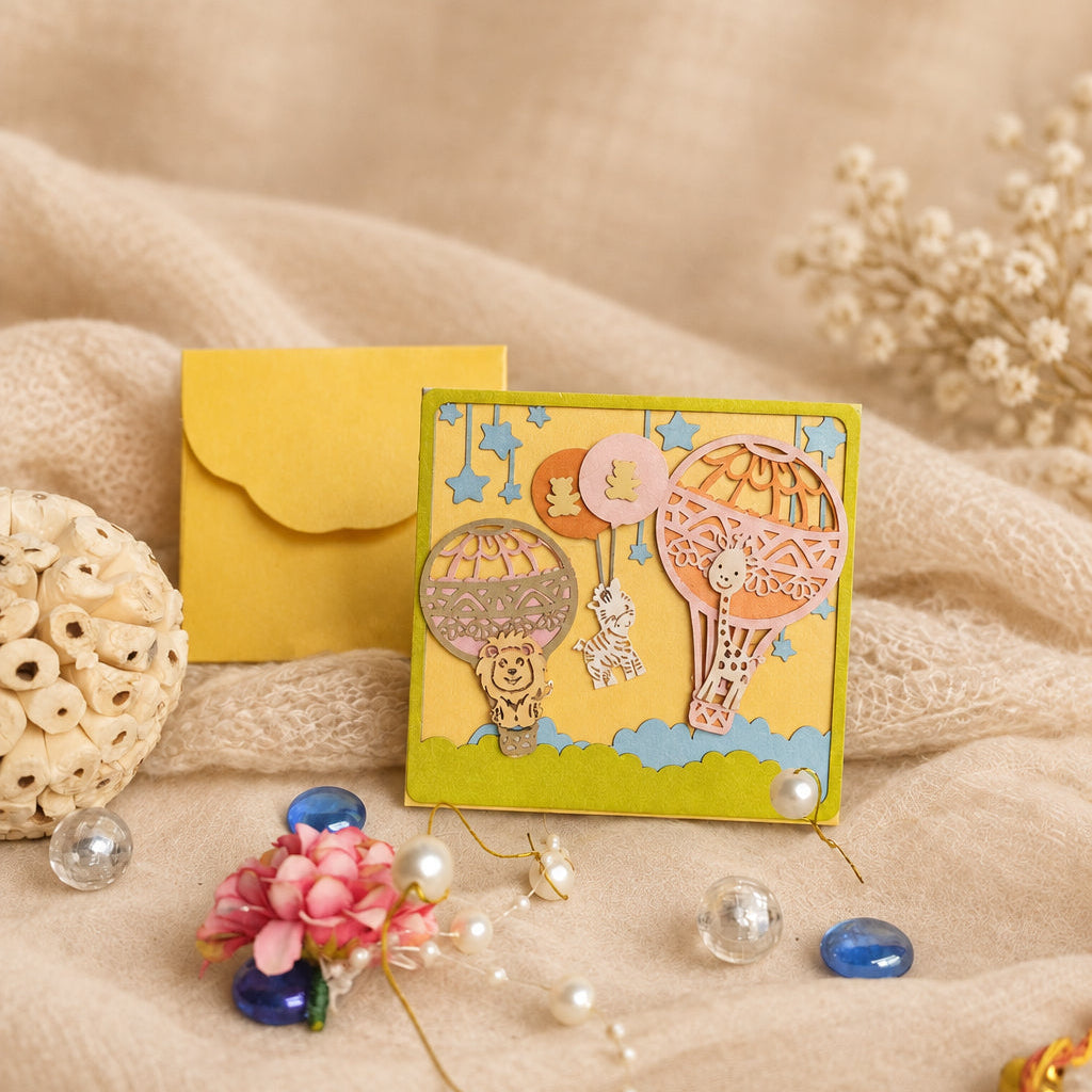 A square handmade small envelope featuring a whimsical hot air balloon scene with a lion and giraffe