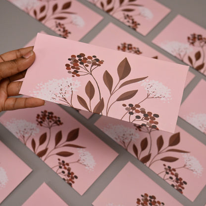 envelope featuring a botanical floral print in brown and white