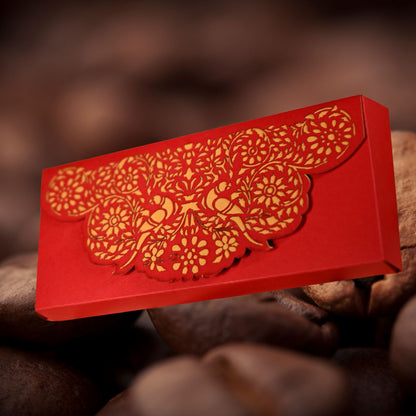 Red ca boshx with gold floral and bird patterns