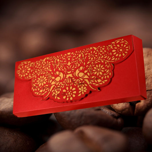 Red ca boshx with gold floral and bird patterns