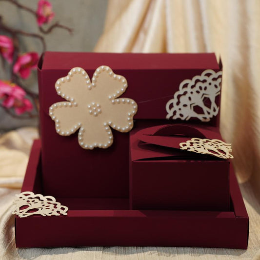 red dry fruit gift box set with floral designs and pearl embellishments