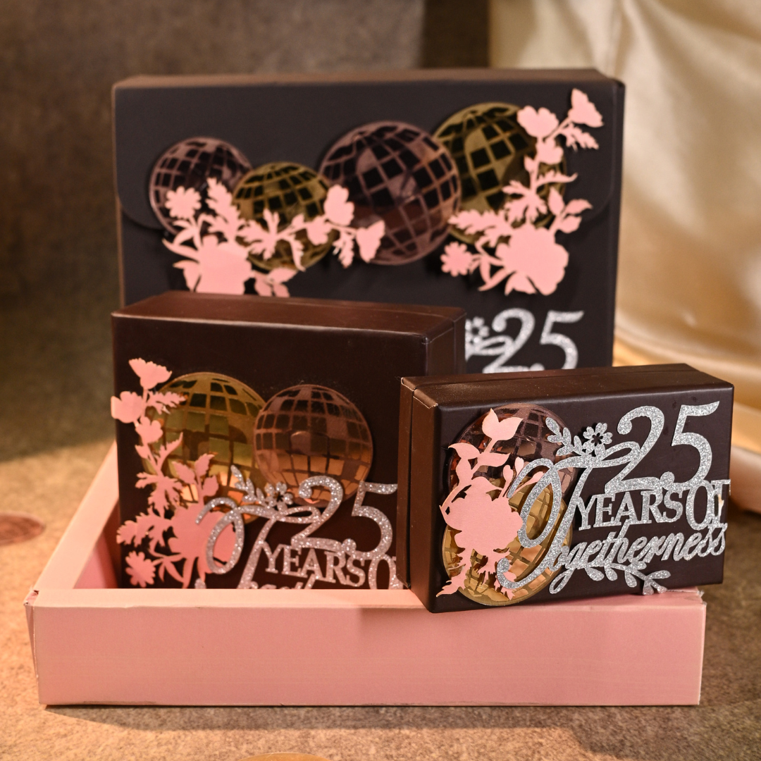 Three engraved gift boxes with a pink tray, featuring disco ball and floral laser-cut designs, with text overlays reading 'Dolfin Creative Digital' and 'GIFT SETS YOU CAN NOT MISS'.