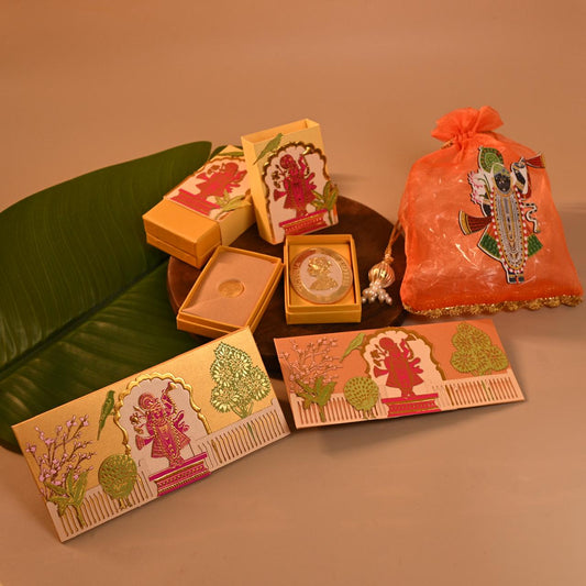 Set of decorative Envelope, coin boxes and an orange pouch with intricate designs, the theme is Pitchwai, tanjore and Srinathji