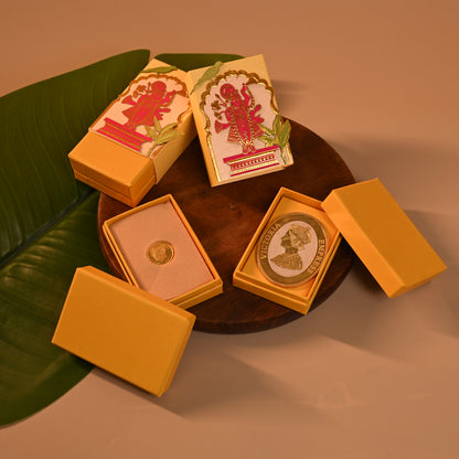 Set of decorative Envelope, coin boxes and an orange potli with intricate designs, the theme is Pichwai, tanjore and Srinathji