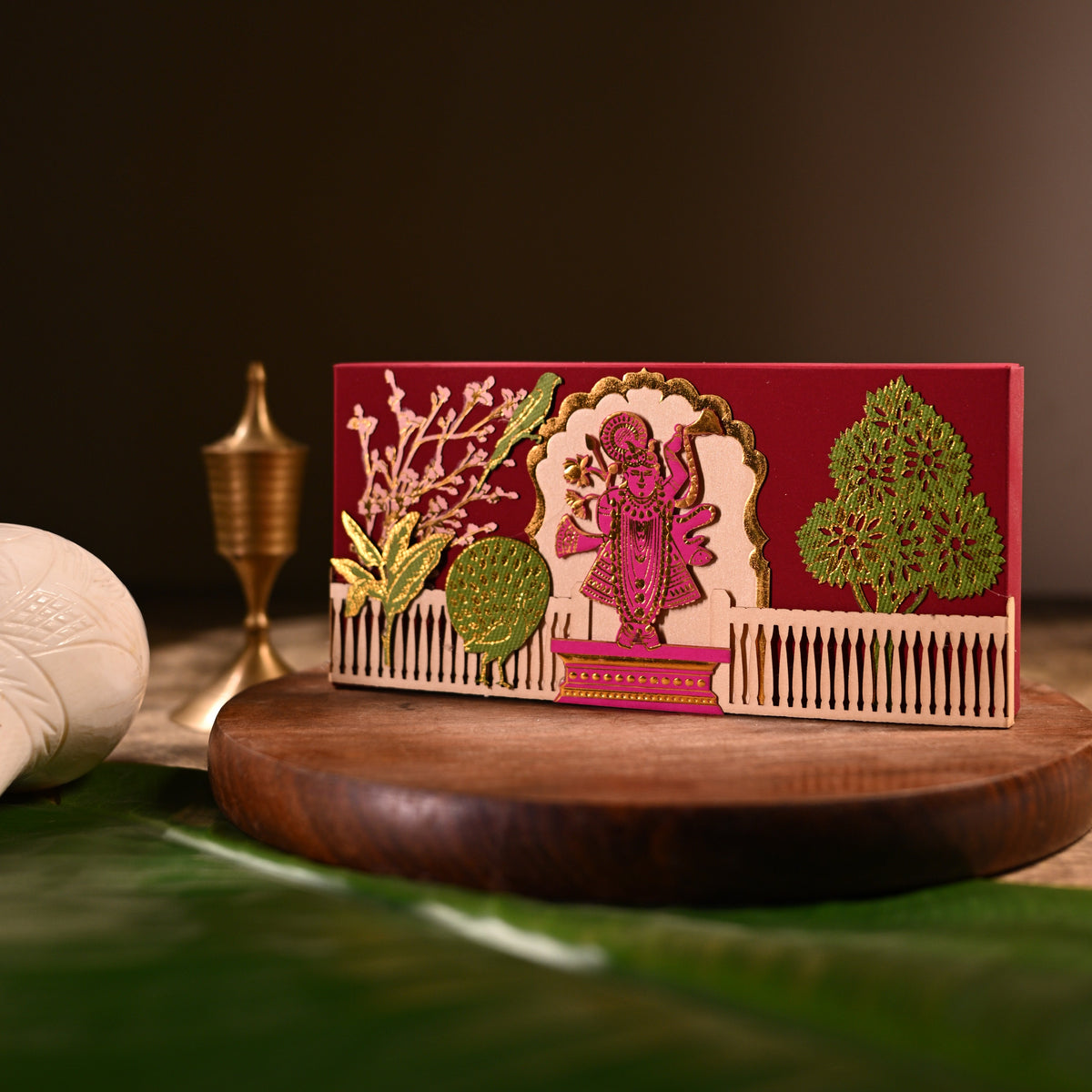Red cash box, with gold tanjore like wok with foil and lazer cutting  