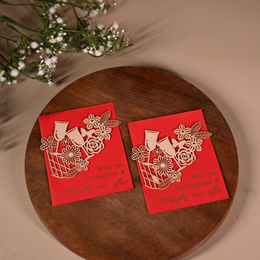 red gift tags with floral laser-cut patchwork and drinking glasses