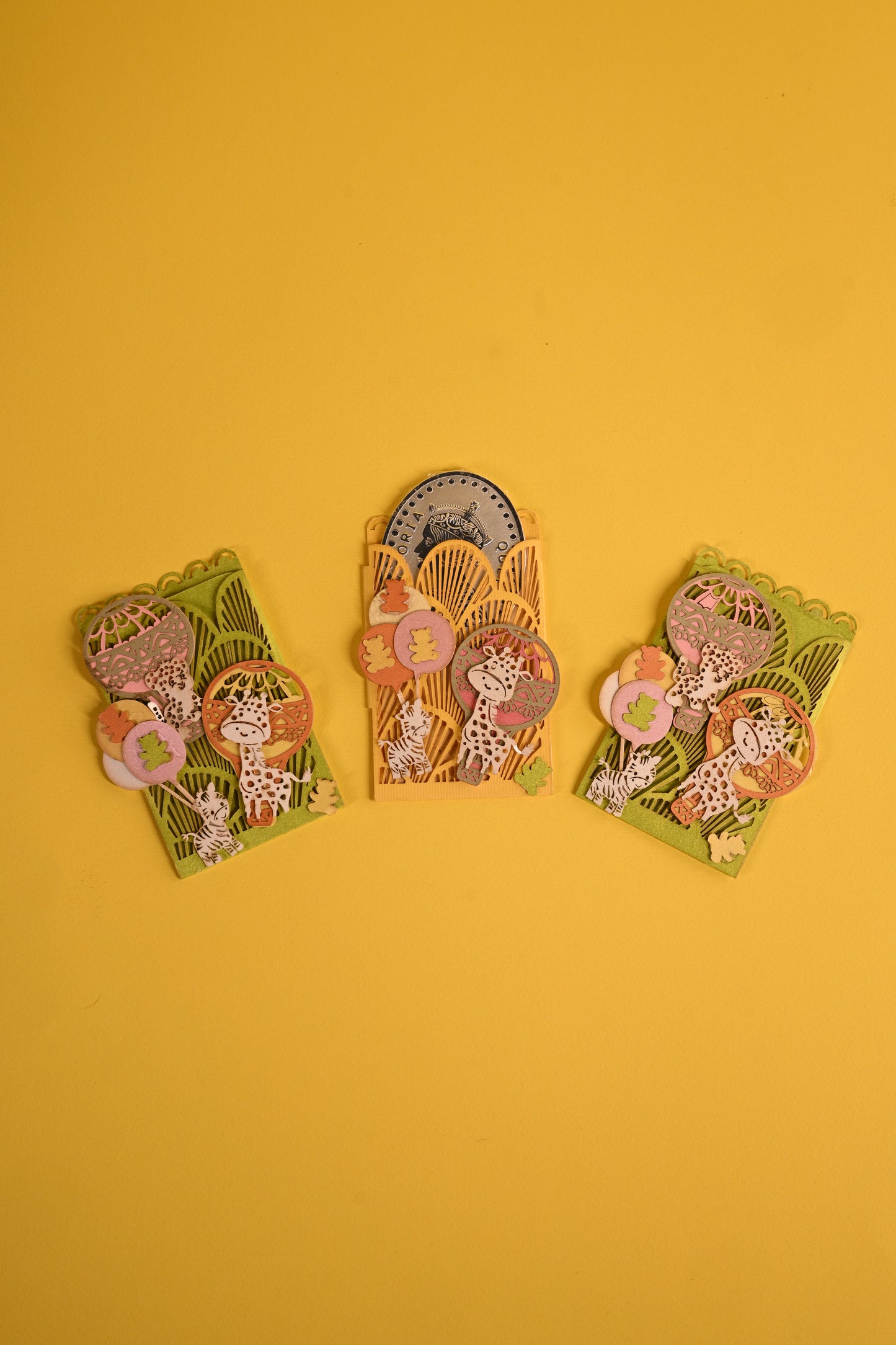 Animal themed coin holders in bright colours with laser cutting