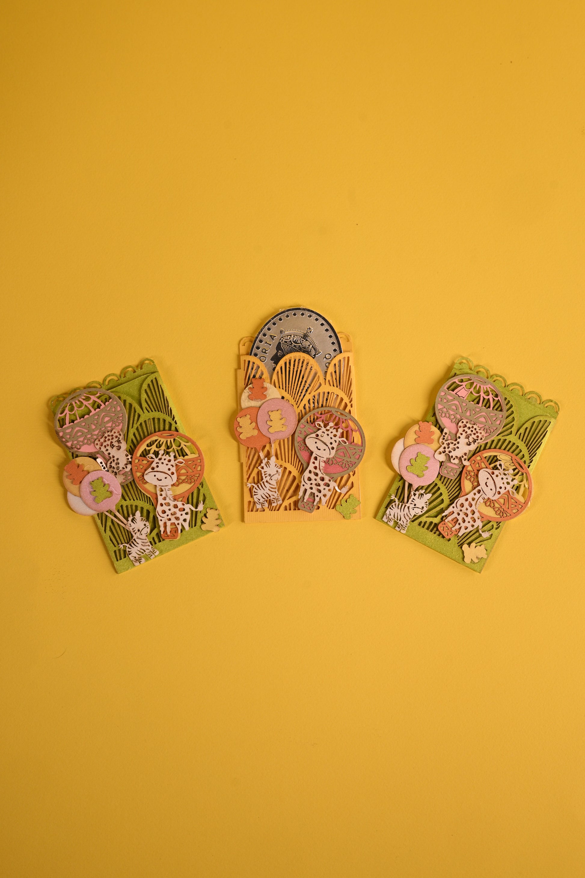 Animal themed coin holders in bright colours with laser cutting