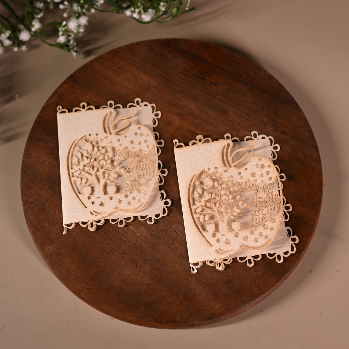 gift tag with laser cut apple design with tree inside it
